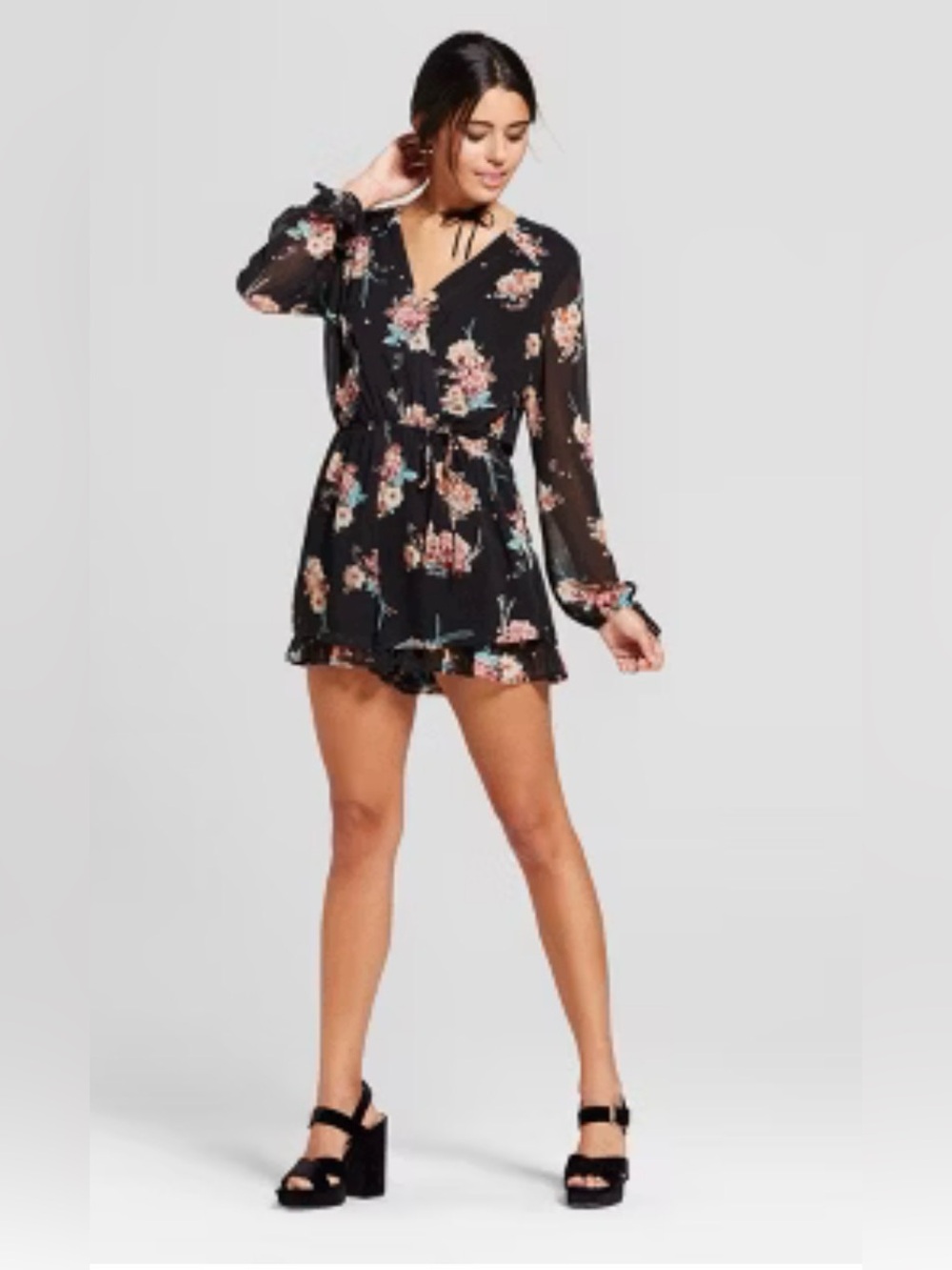 Flower romper with ruffle detail.